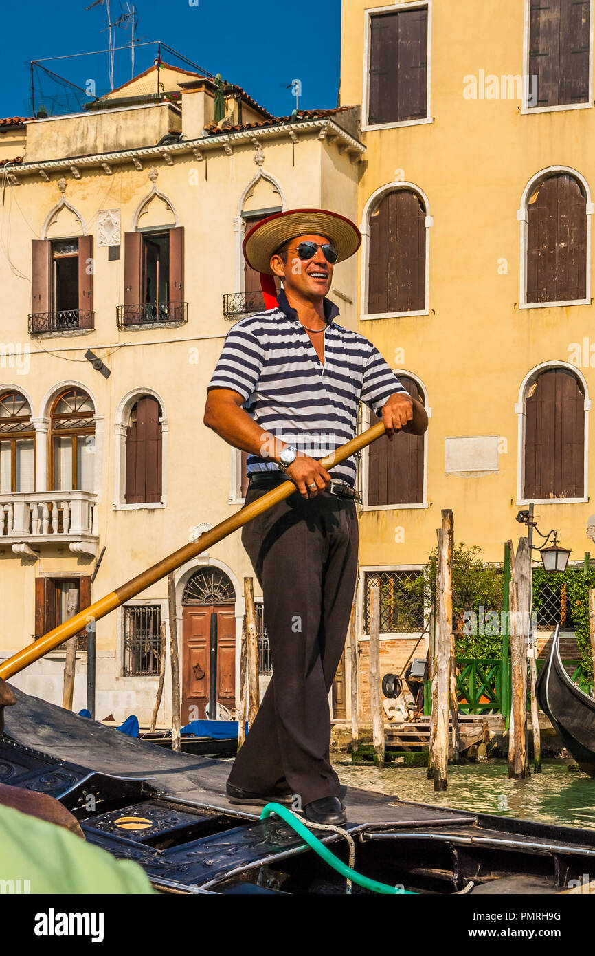 Gondolier on the Grand Canal, Venice, Italy. Stock Photo