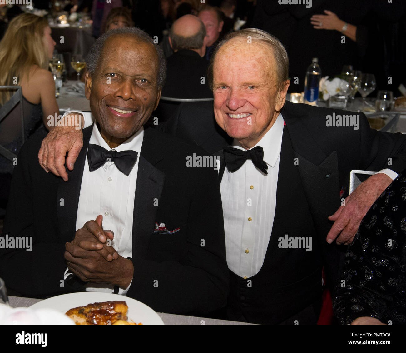 Oscar®-winning actor Sidney Poitier (left) and Honorary Award recipient George Stevens Jr. attend the 2012 Governors Awards at The Ray Dolby Ballroom at Hollywood & Highland Center® in Hollywood, CA, Saturday, December 1.  File Reference # 31744 046  For Editorial Use Only -  All Rights Reserved Stock Photo