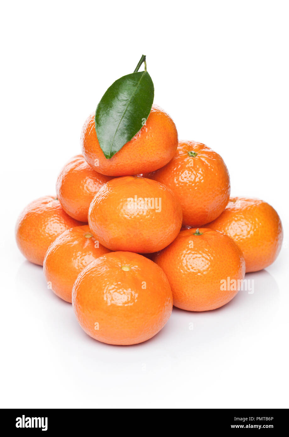 Fresh organic mandarins tangerines fruits with leaves on white