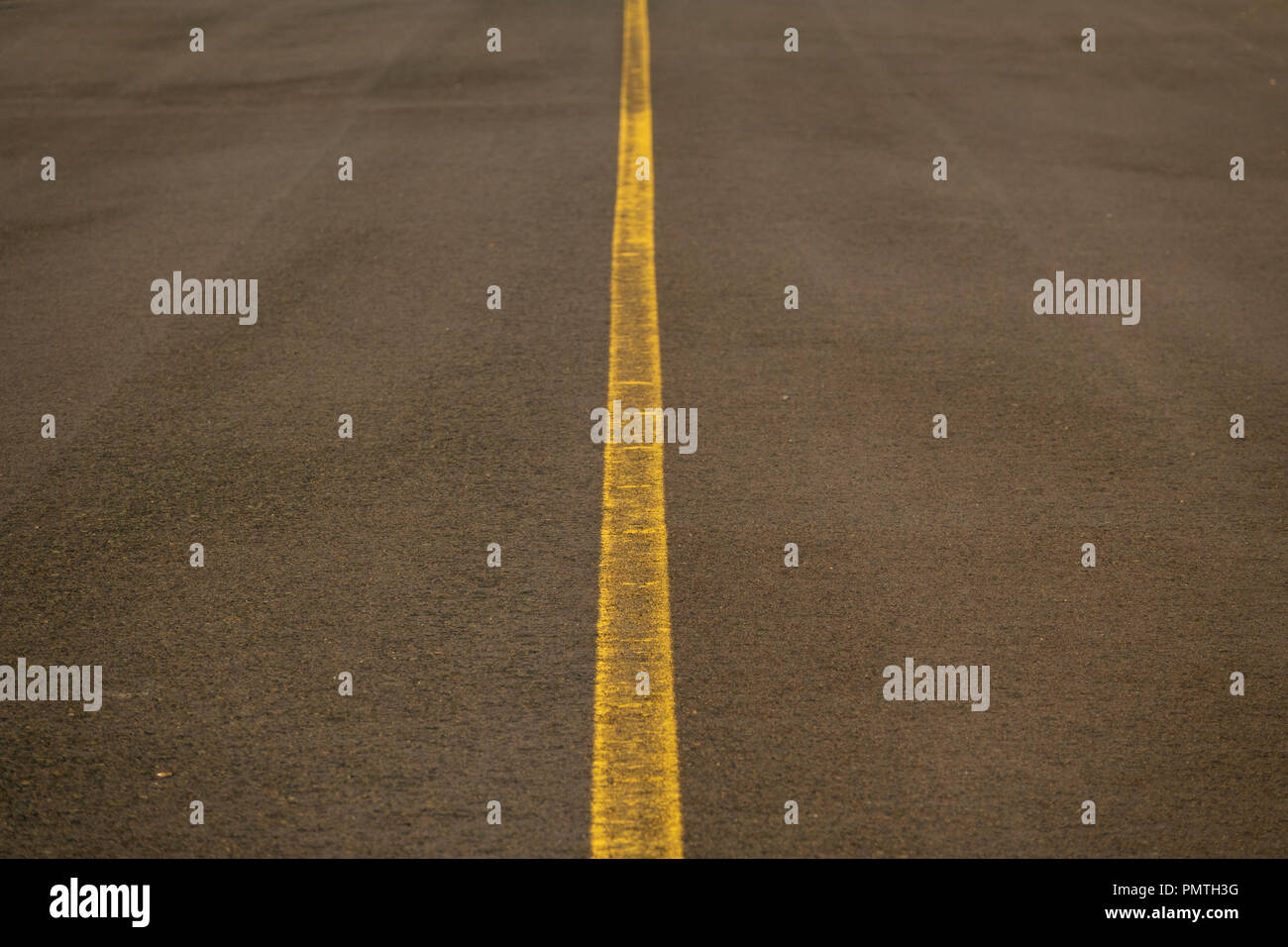 Road with yellow line in the middle Stock Photo - Alamy