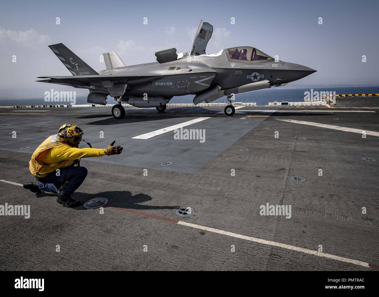 March 8, 2018 - GULF OF ADEN - GULF OF ADEN (Sept. 16, 2018) Aviation Boatswainâ€™s Mate 1st Class Landon Jamison launches an F-35B Lightning II attached to the Avengers of Marine Fighter Attack Squadron (VMFA) 211 from the flight deck of the Wasp-class amphibious assault ship USS Essex (LHD 2) during a scheduled deployment of the Essex Amphibious Ready Group (ARG) and 13th Marine Expeditionary Unit (MEU). The Essex ARG/13th MEU is the first U.S. Navy/Marine Corps team to deploy tot eh U.S. 5th Fleet area of operations with the transformational warfighting capabilities of the F-35B Lightning I Stock Photo