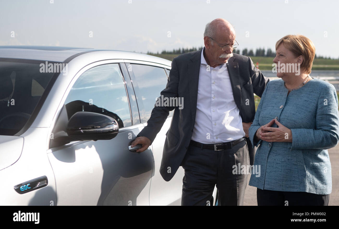 19 September 2018, Baden-Wuerttemberg, Immendingen: German Chancellor Angela Merkel (CDU) and Dieter Zetsche, Chairman of the Board of Management of Daimler AG, will stand next to a Mercedes-Benz EQC 400 4MATIC when the company's new testing and technology center goes into operation. Photo: Marijan Murat/dpa Credit: dpa picture alliance/Alamy Live News Stock Photo