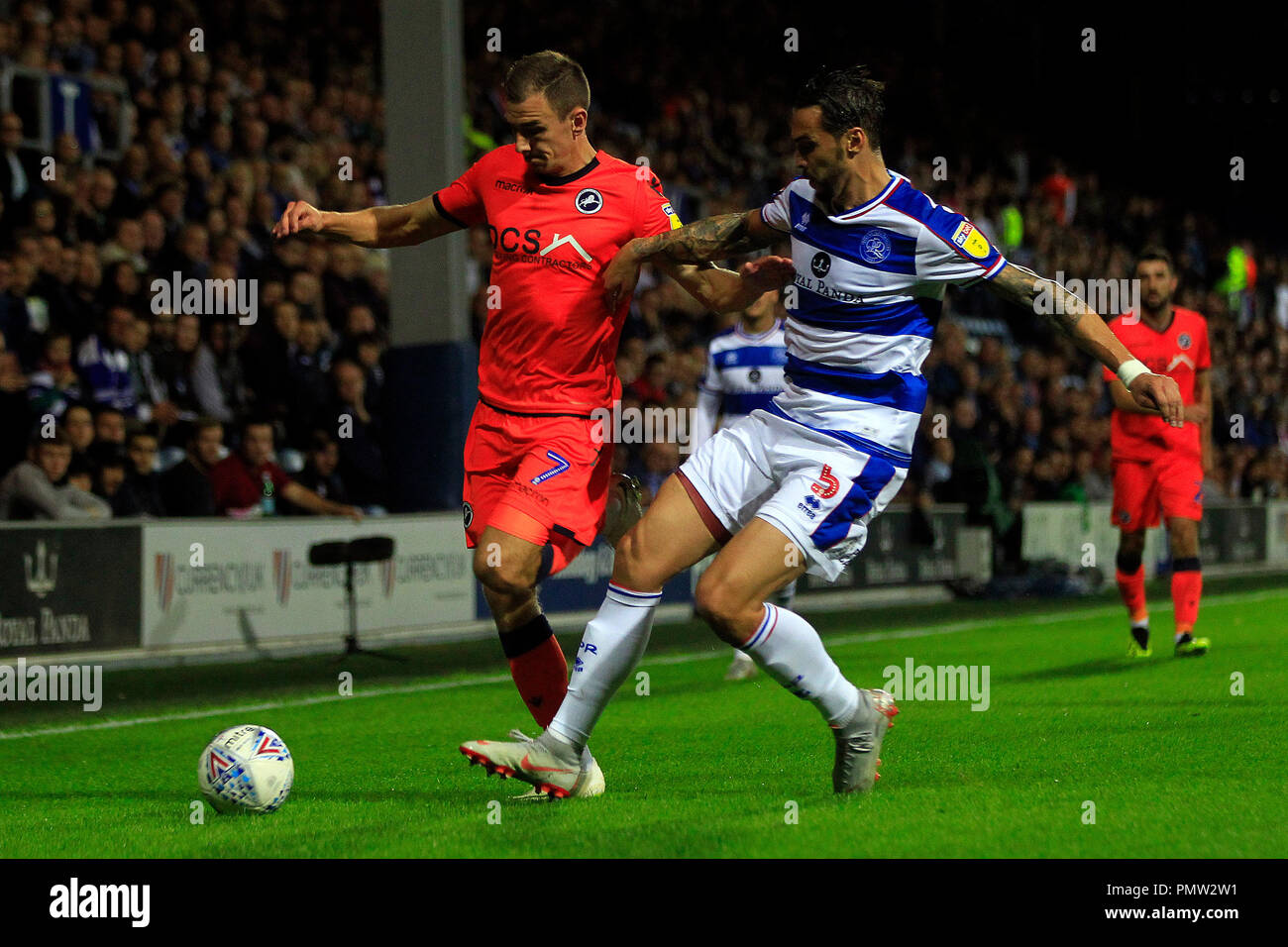 London, UK. 19th September 2018. Geoff Cameron of Queens Park Rangers (R) in action with Jed Wallace of Millwall (L). EFL Skybet championship match, Queens Park Rangers v Millwall at Loftus Road stadium in London on Wednesday 19th September 2018.  this image may only be used for Editorial purposes. Editorial use only, license required for commercial use. No use in betting, games or a single club/league/player publications. pic by Steffan Bowen/Andrew Orchard sports photography/Alamy Live news Stock Photo