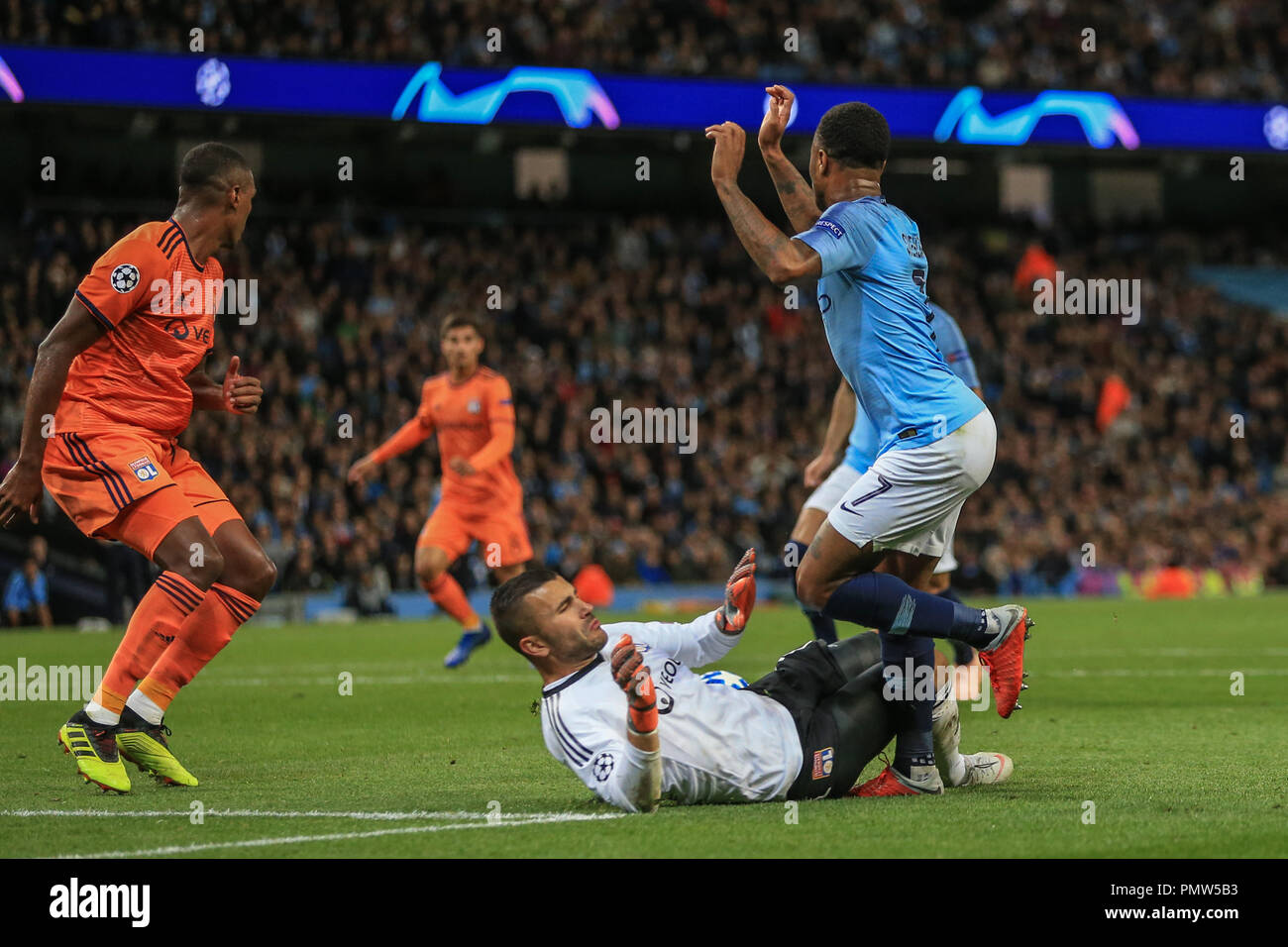London, UK. 19th September 2018, Etihad Stadium, London, England; UEFA Champions League, Manchester City v Lyon; Anthony Lopes (01) of Lyon brings Raheem Sterling (07) of Manchester City down in the area but refaree Daniel Orsato says goal kick  Credit: Mark Cosgrove/News Images Stock Photo