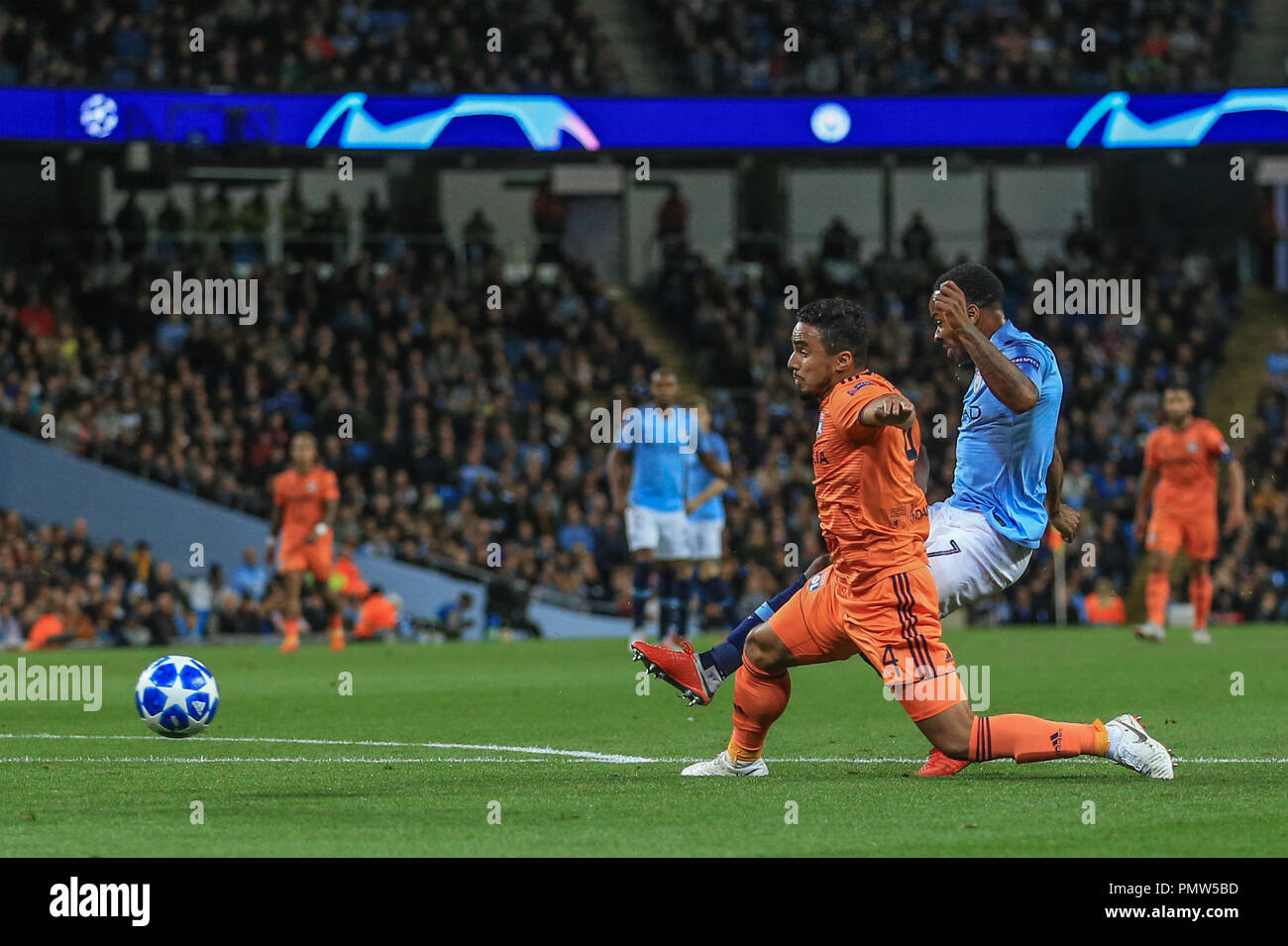 London, UK. 19th September 2018, Etihad Stadium, London, England; UEFA Champions League, Manchester City v Lyon; Raheem Sterling (07) of Manchester City shoots on goal and it's saved by Anthony Lopes (01) of Lyon   Credit: Mark Cosgrove/News Images Stock Photo
