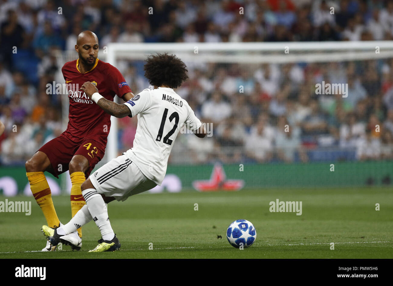 Madrid, Madrid, Spain. 19th Sep, 2018. Marcelo (Real Madrid) competes for the ball with Steven N'Zonzi (AS Roma) during the UEFA Champions' League group G football match Real Madrid against AS Roma at the Santiago Bernabeu Stadium in Madrid.Final Score Credit: Manu Reino/SOPA Images/ZUMA Wire/Alamy Live News Stock Photo