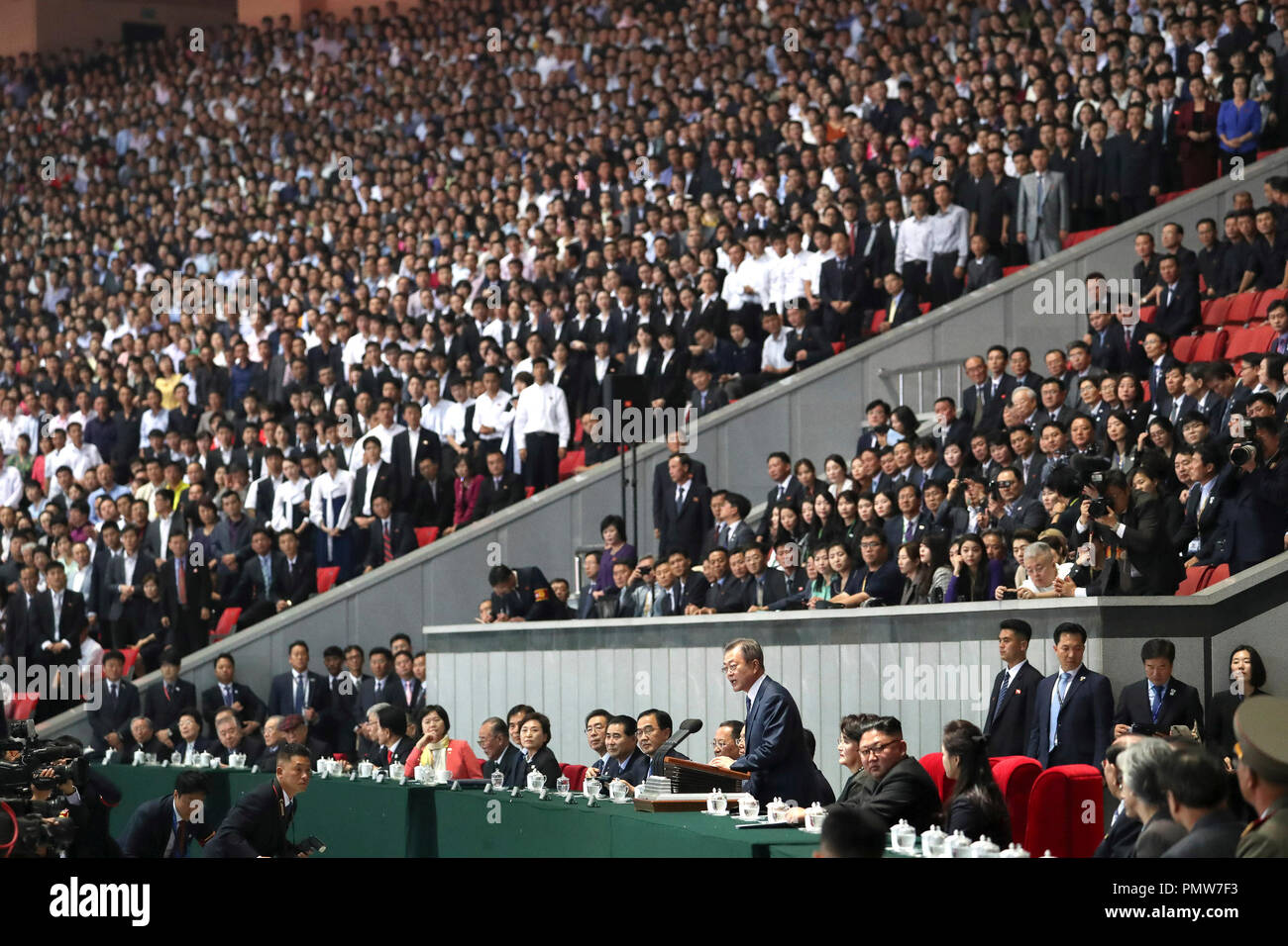Sep 20, 2018 - Pyeongyang, North Korea - South Korean President Moon Jae-in watched a controversial mass gymnastics performance in Pyongyang late Wednesday on the second day of his trip, alongside North Korean leader Kim Jong-un. As the two leaders entered the May Day Stadium, the venue of the performance, together at about 9 p.m, some 150,000 Pyongyang citizens cheered and gave them an emotional standing ovation. The cheers became louder when Moon waved his hands toward the crowd. (Credit Image: © Pool/Pyongyang Press Corps via ZUMA Wire) Stock Photo