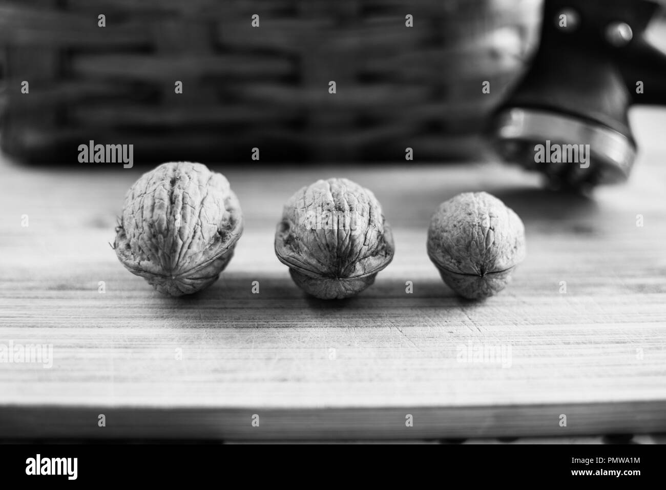 Closeup of hazelnuts and walnuts on a table Stock Photo