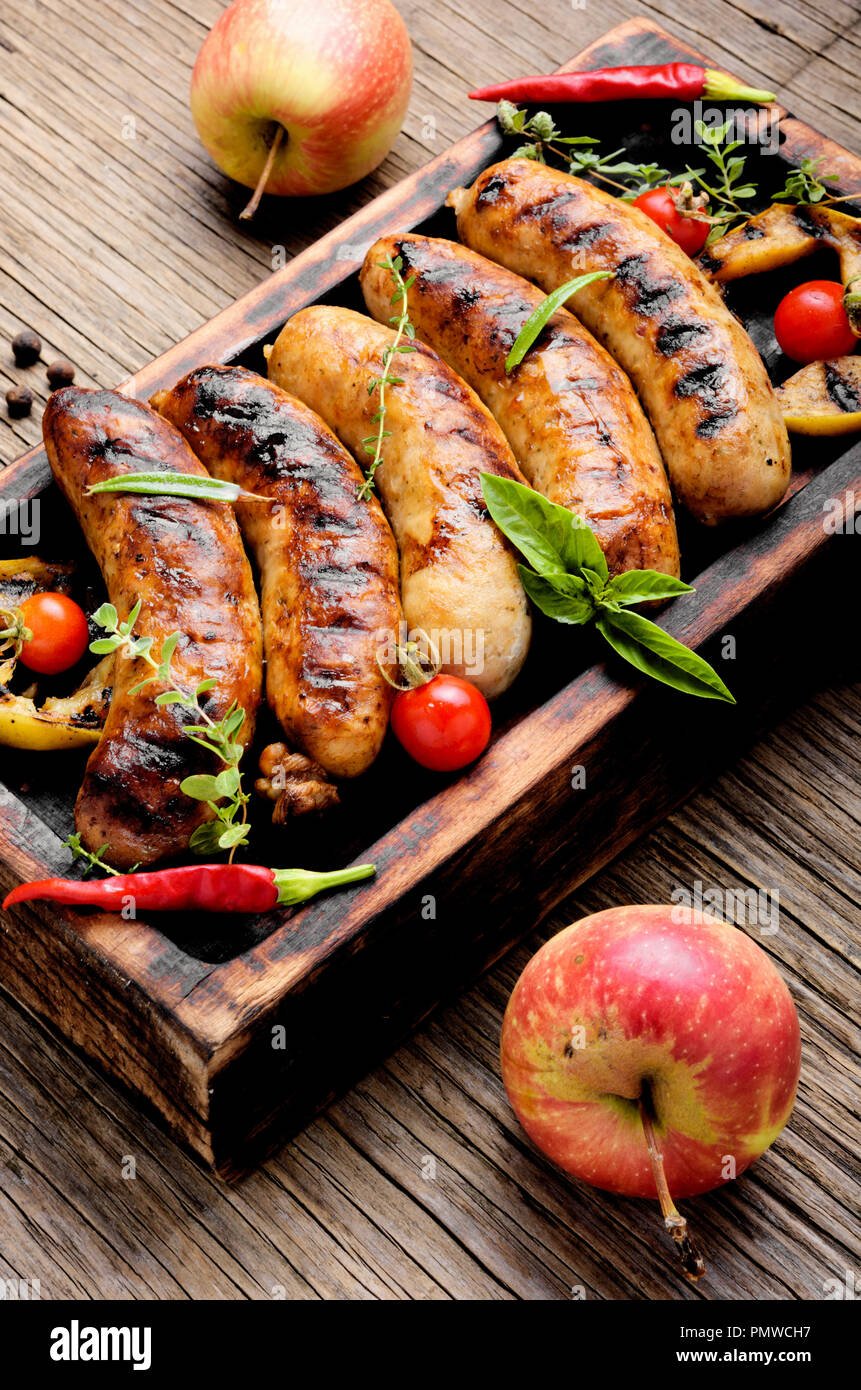 Delicious sausages grilled with spices and apples.Meat German food