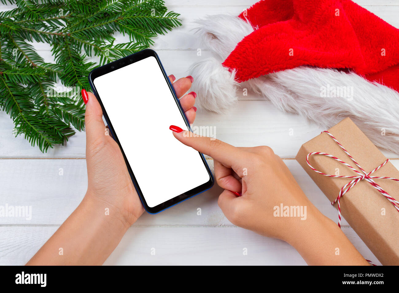 female buyer makes order at screen of smartphone with copy space winter holidays sales christmas online shopping - Christmas Eve Sales female buyer makes order at screen of smartphone with copy space winter holidays sales christmas online shopping - Christmas Eve Sales