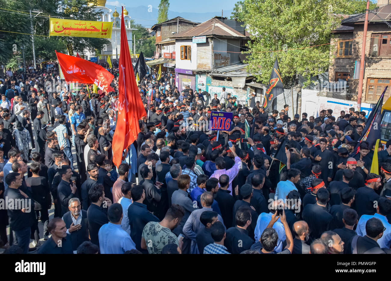 Kashmiri Shia Muslims seen performing rituals with flags during the ...