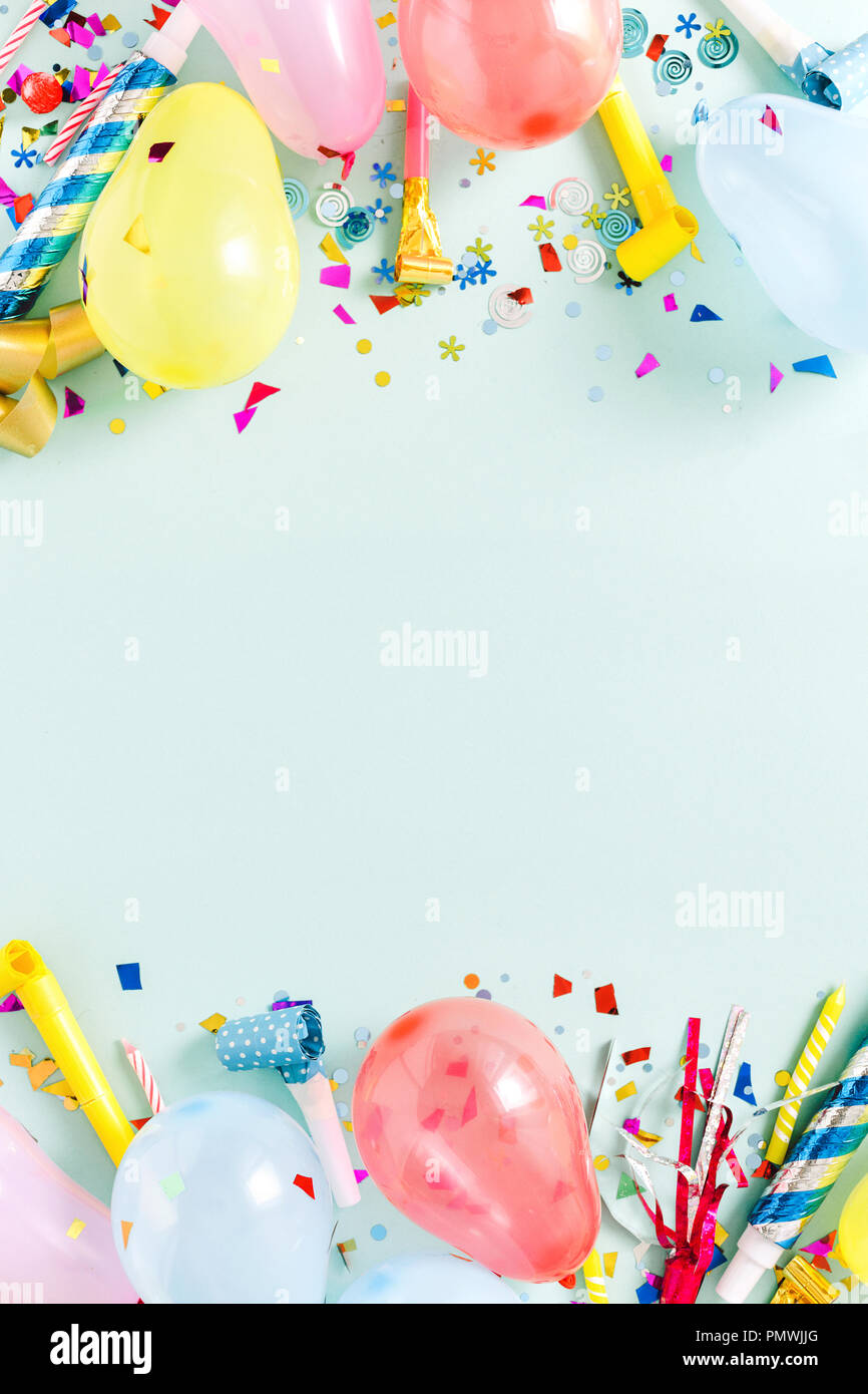 Party background with balloons, streamers and confetti on pastel blue  background. Birthday party decoration Stock Photo - Alamy