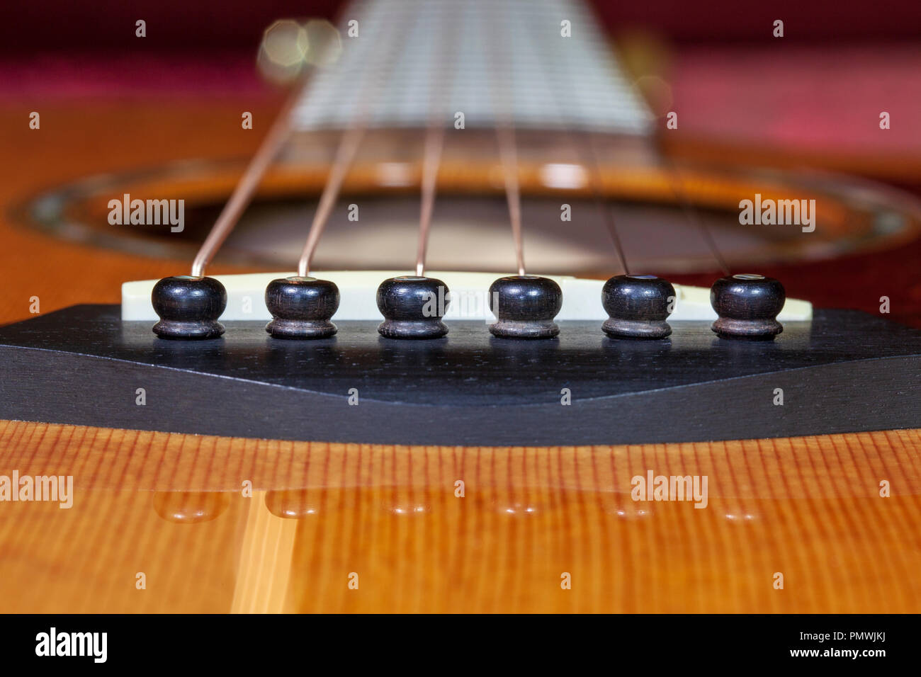 Close-up of an Acoustic Guitar, strings and bridge Stock Photo