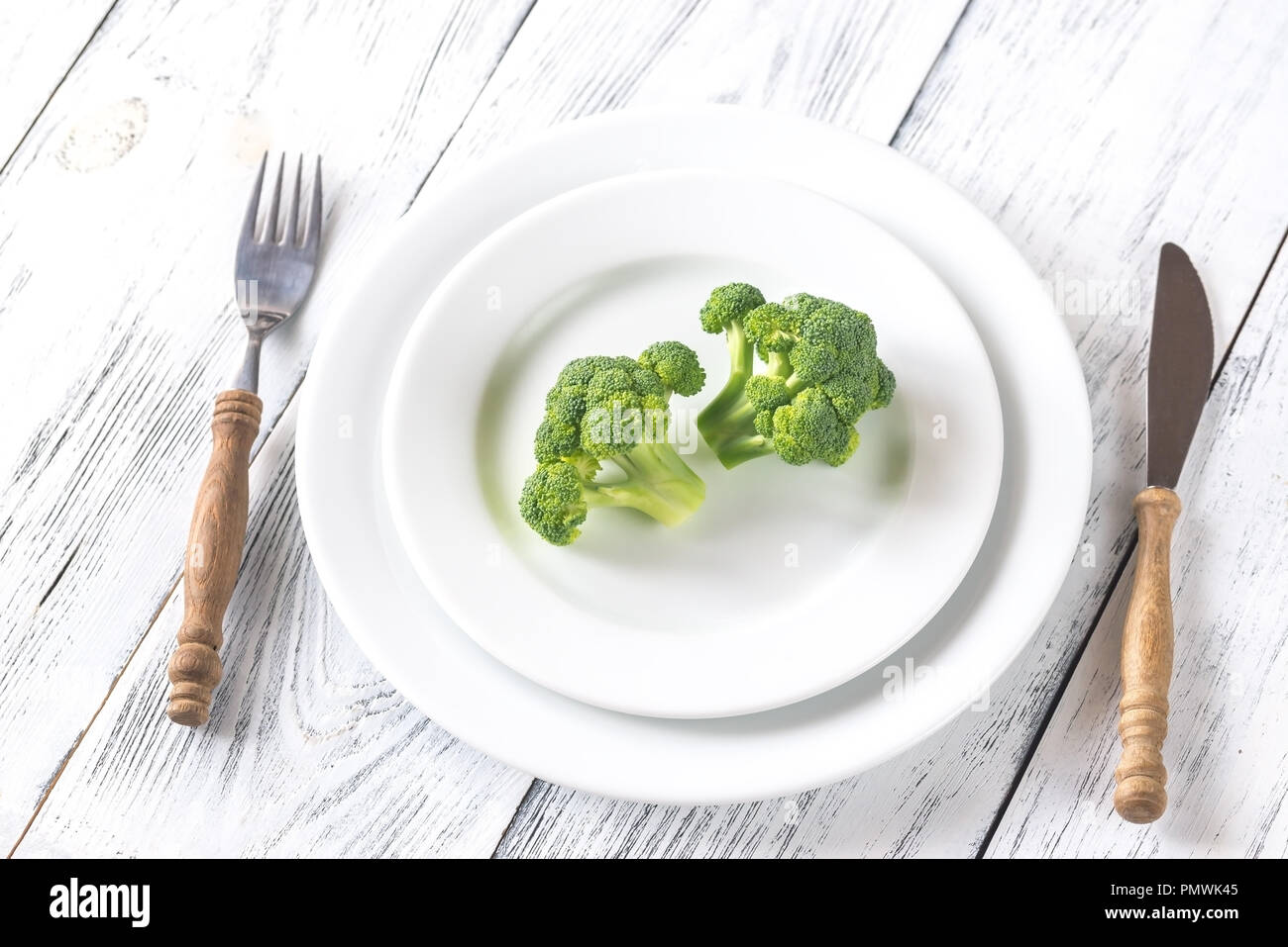 Fresh broccoli on the white plate Stock Photo