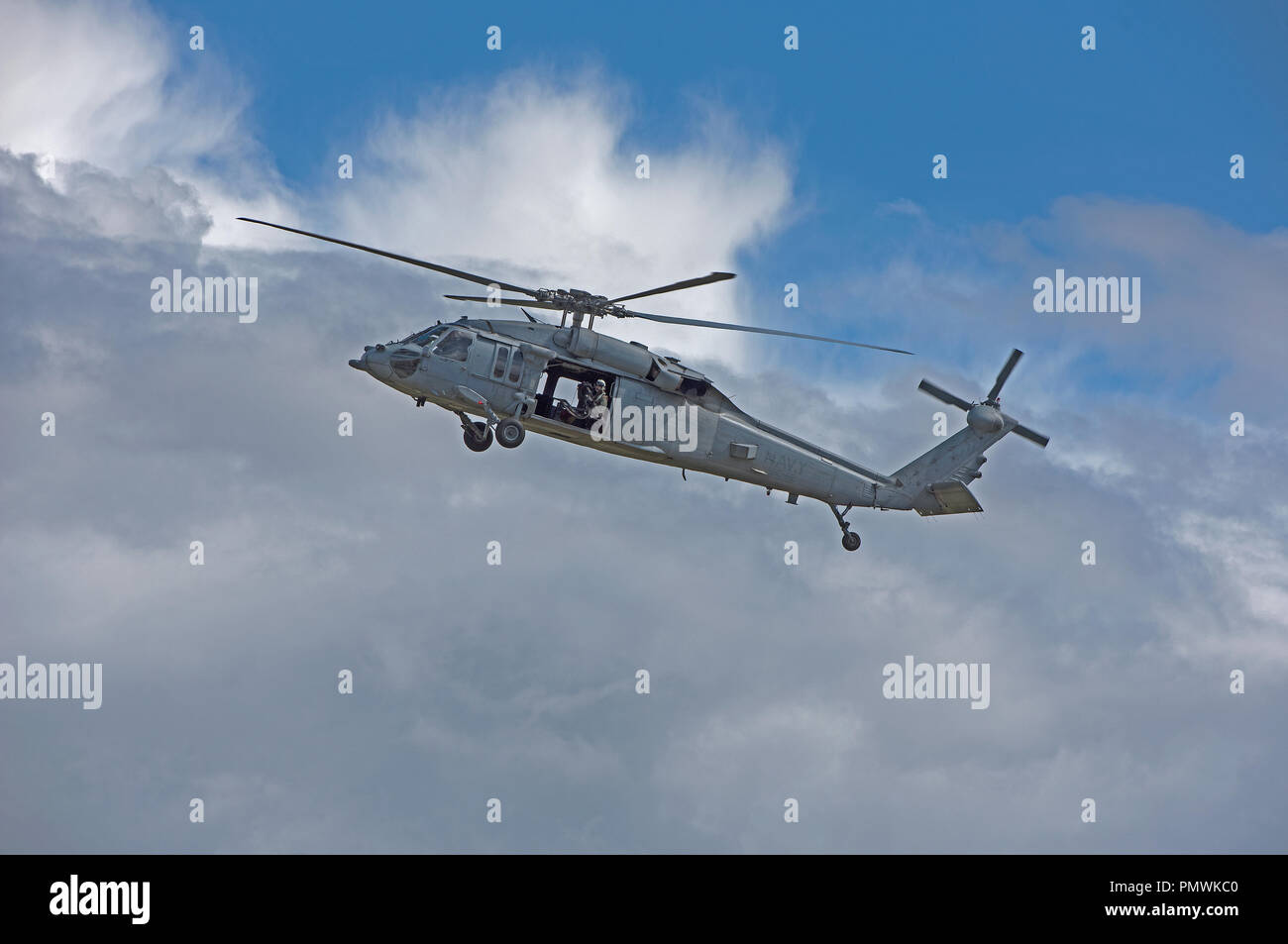 USNAVY MH-60 Seahawk helicopter on gunnery training exercise at Tain range, flying out from the RAF base at Lossiemouth in Moray, Scotland. Stock Photo