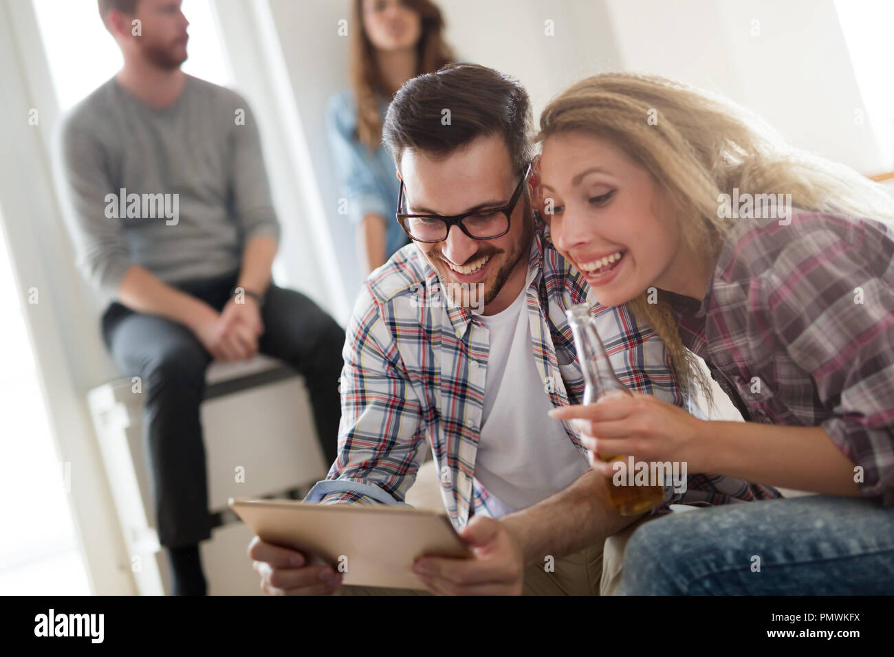 Happy couple in love surfing on tablet at home Stock Photo
