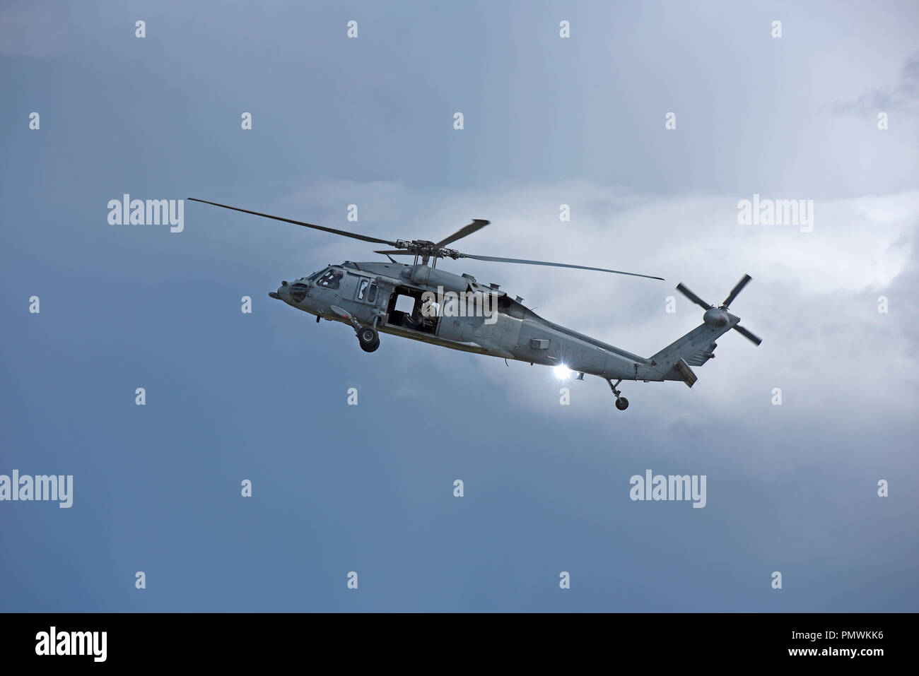 USNAVY MH-60 Seahawk helicopter on gunnery training exercise at Tain range, flying out from the RAF base at Lossiemouth in Moray, Scotland. Stock Photo