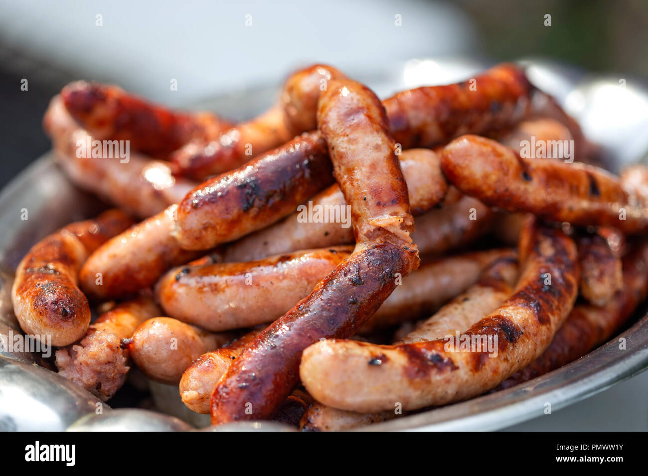 Grilleg pork sausages on the plate - close up view Stock Photo