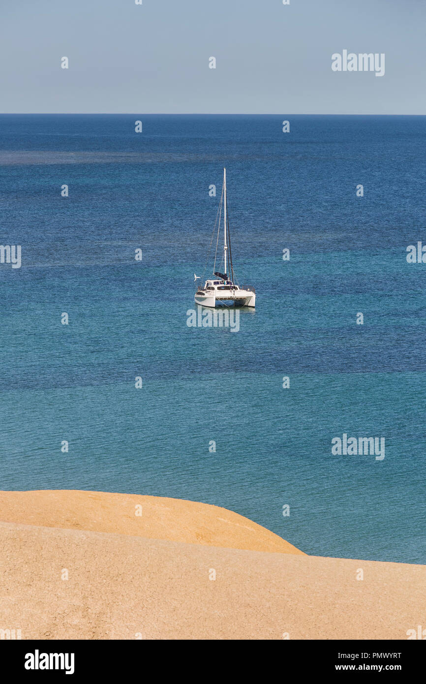 Catamaran on sunny, tranquil ocean, Port Willunga, South Australia, Australia Stock Photo