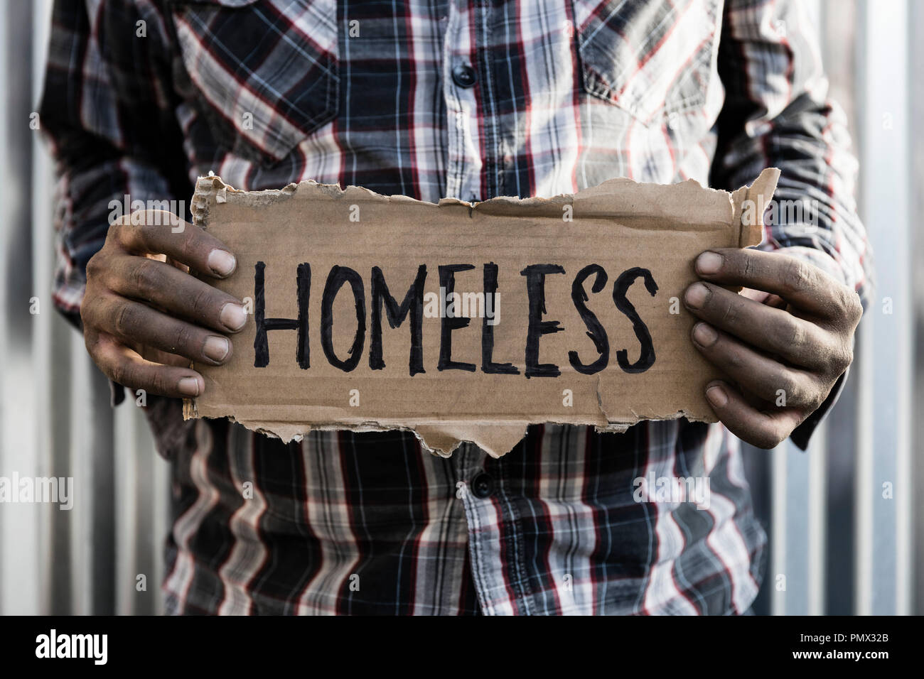 Homeless man holding cardboard sign hires stock photography and images