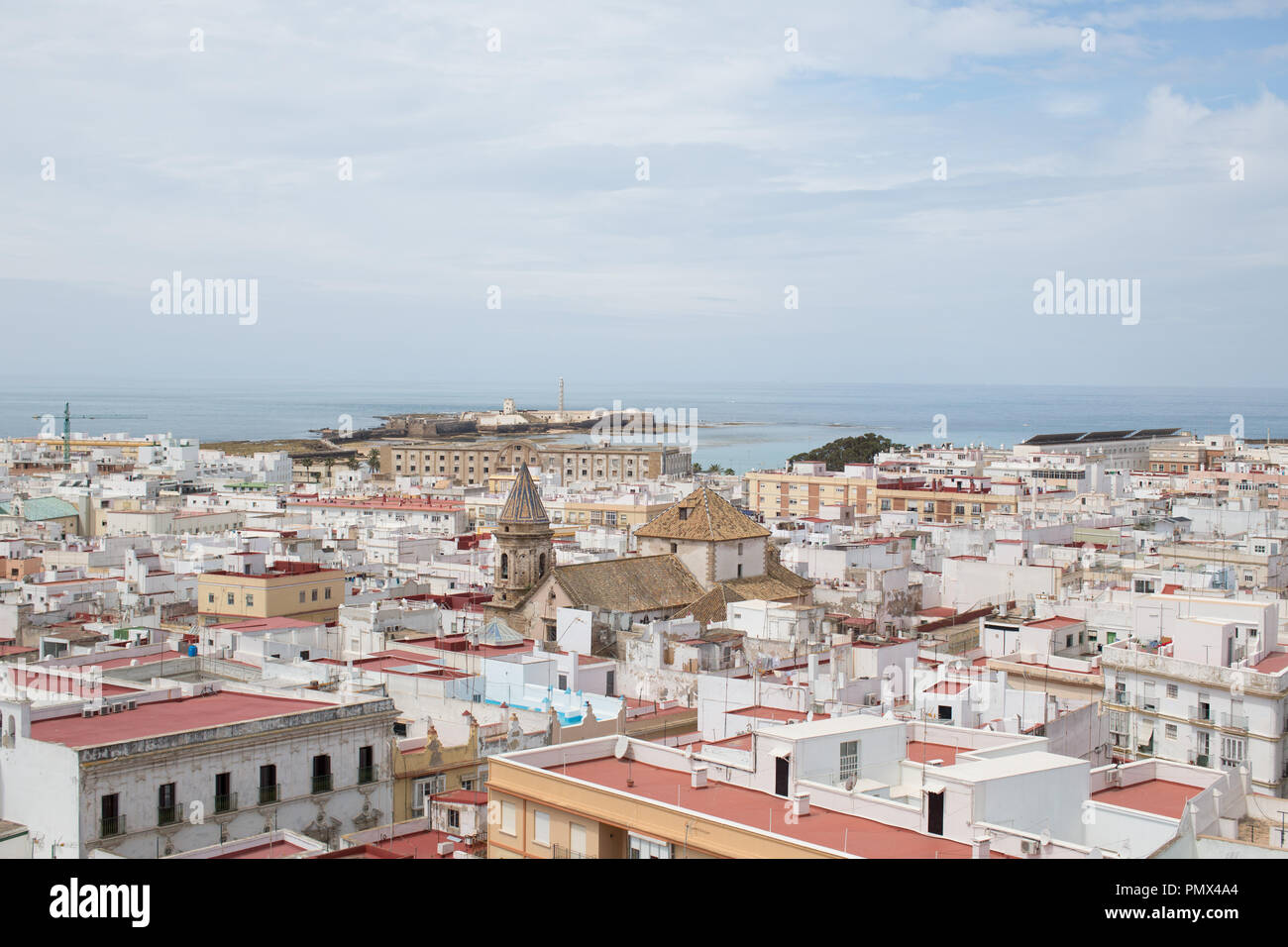 A view looking down on the rooftops of the city of Cadiz in Spain from the Tavira Tower (camera obscura) with the coastline and sea in the distance Stock Photo