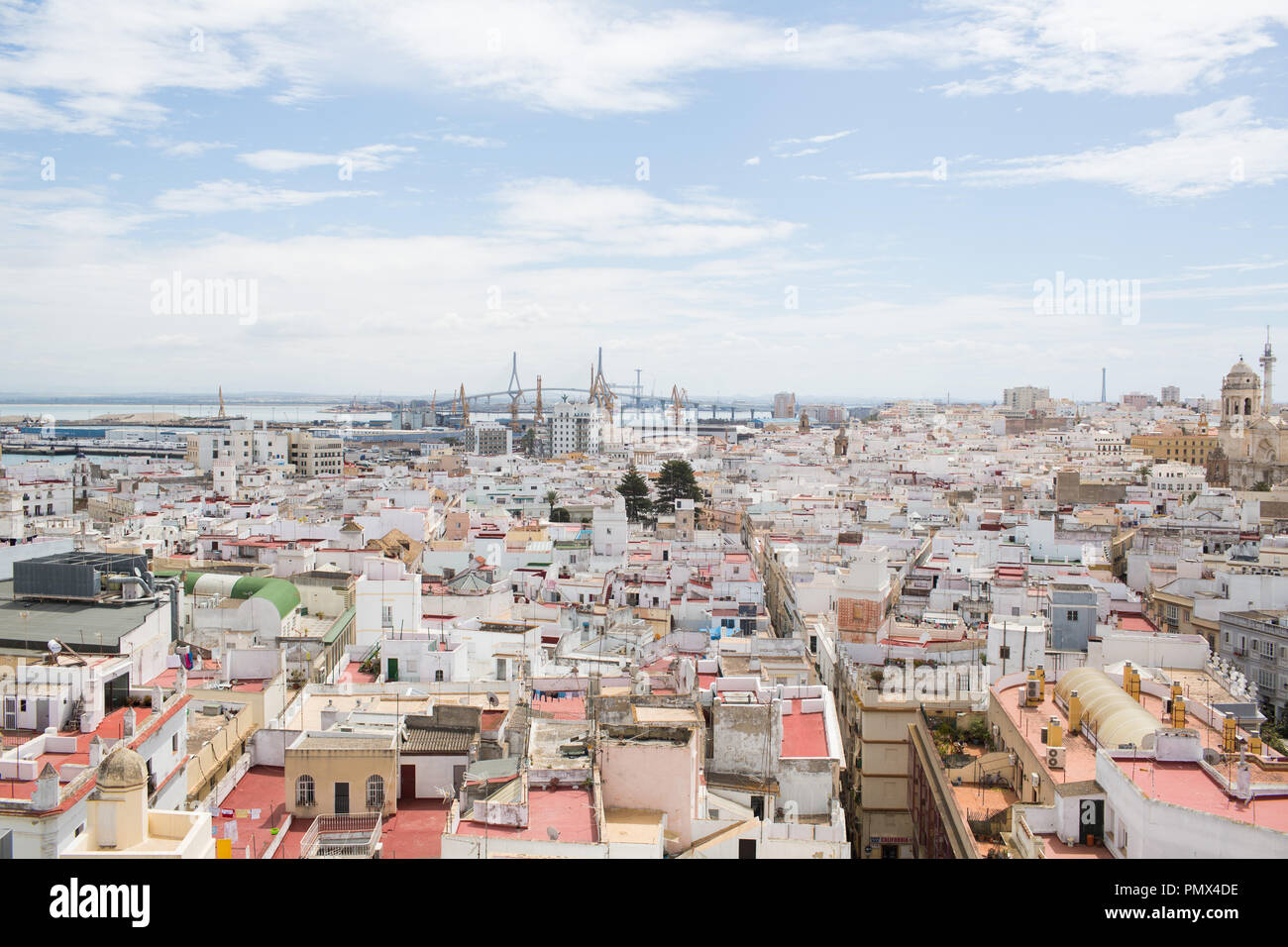 A view looking down on the rooftops of the city of Cadiz in Spain from the Tavira Tower (camera obscura) with the La Pepa Bridge in the distance Stock Photo