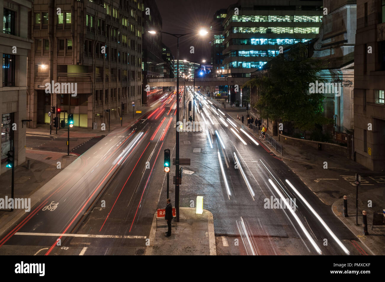 London, England, UK - October 13, 2010: Traffic flows along Lower Thames Street, the main dual carriageway route through the City of London financial  Stock Photo