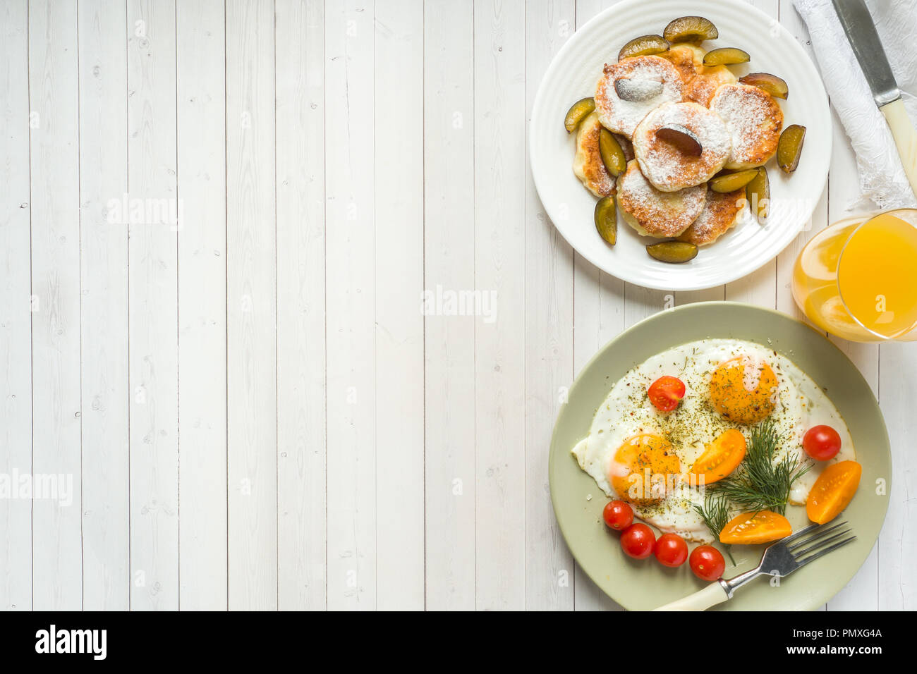 Concept Of Breakfast Fried Eggs Cottage Cheese Pancakes Plums