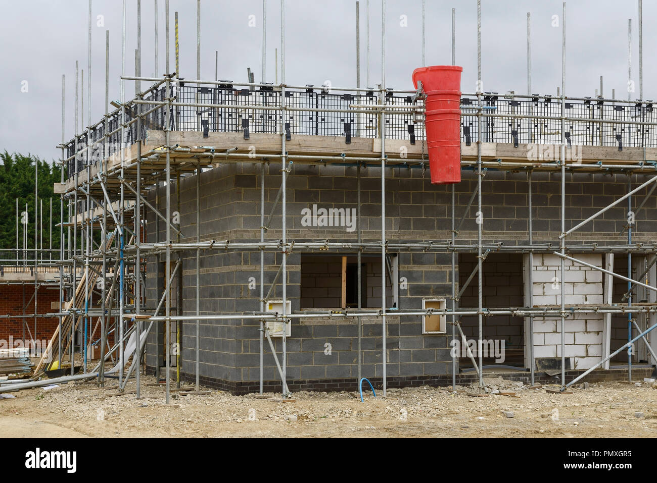 Scaffolding surrounding a house under construction on a housing development in Norfolk UK Stock Photo