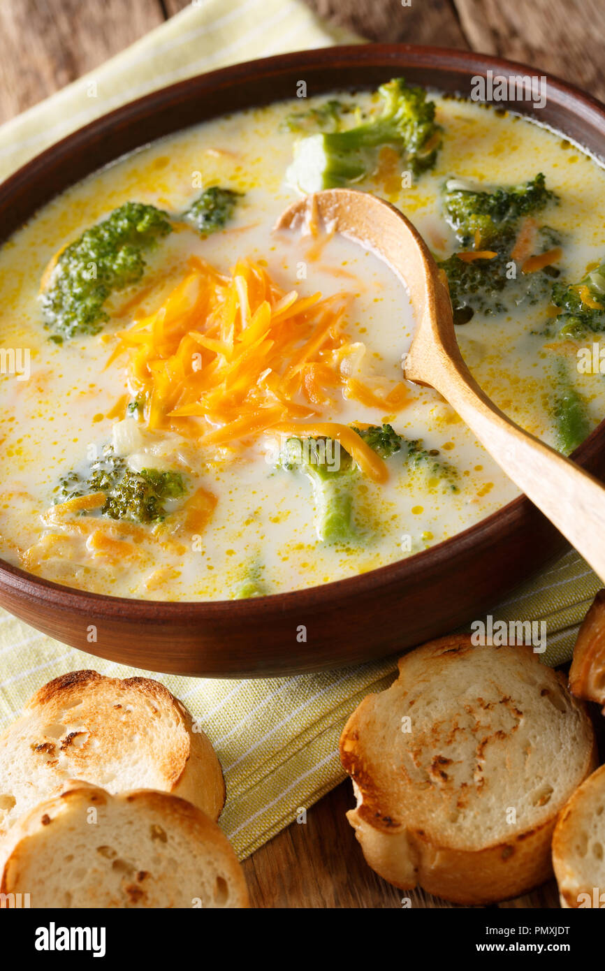 Delicious broccoli cheddar cheese soup in a bowl with toasted bread