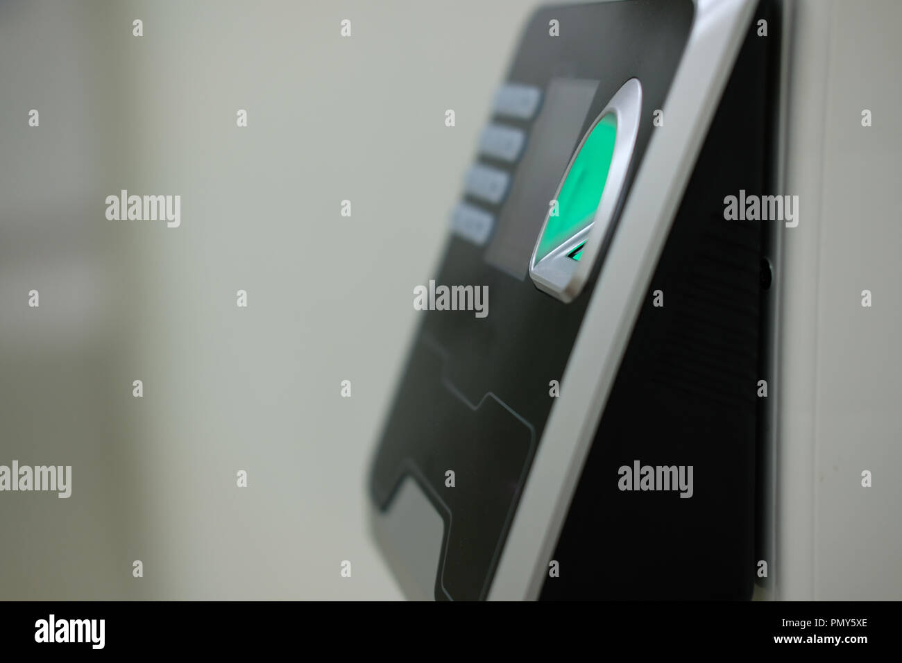 finger print scanning on access control machine. hour work time ...