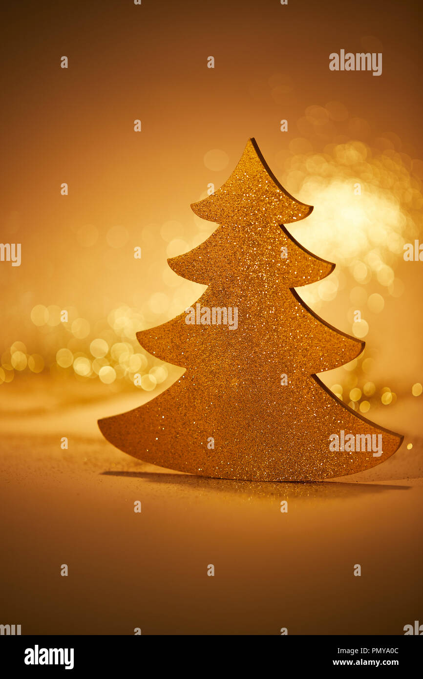 golden glittering christmas tree for decoration on tabletop Stock Photo