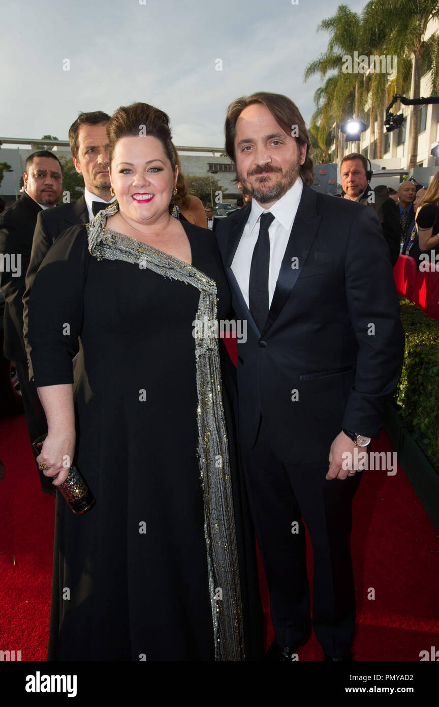 Melissa McCarthy and Ben Falcone attend the 71st Annual Golden Globes Awards at the Beverly Hilton in Beverly Hills, CA on Sunday, January 12, 2014.  File Reference # 32222 183JRC  For Editorial Use Only -  All Rights Reserved Stock Photo