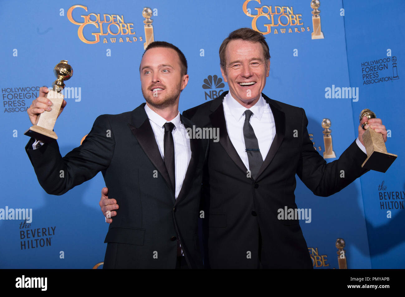 For BEST TELEVISION SERIES – DRAMA, the Golden Globe is awarded to “BREAKING BAD” (AMC), produced by Sony Pictures Television. Aaron Paul and Bryan Cranston pose with the award backstage in the press room at the 71st Annual Golden Globe Awards at the Beverly Hilton in Beverly Hills, CA on Sunday, January 12, 2014.  File Reference # 32222 379JRC  For Editorial Use Only -  All Rights Reserved Stock Photo