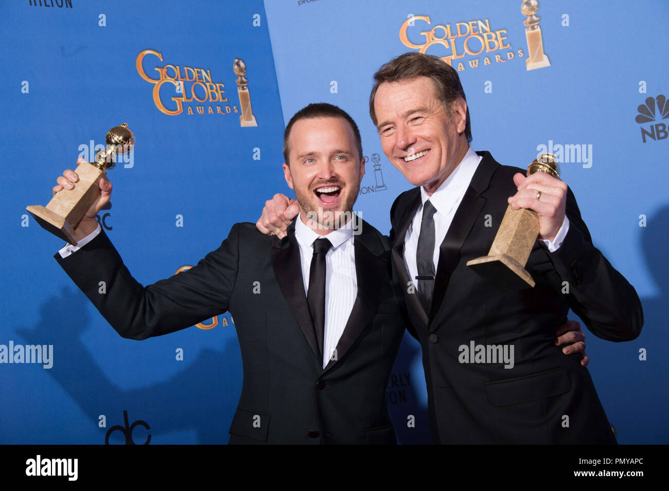 For BEST TELEVISION SERIES – DRAMA, the Golden Globe is awarded to “BREAKING BAD” (AMC), produced by Sony Pictures Television. Aaron Paul and Bryan Cranston pose with the award backstage in the press room at the 71st Annual Golden Globe Awards at the Beverly Hilton in Beverly Hills, CA on Sunday, January 12, 2014.  File Reference # 32222 380JRC  For Editorial Use Only -  All Rights Reserved Stock Photo