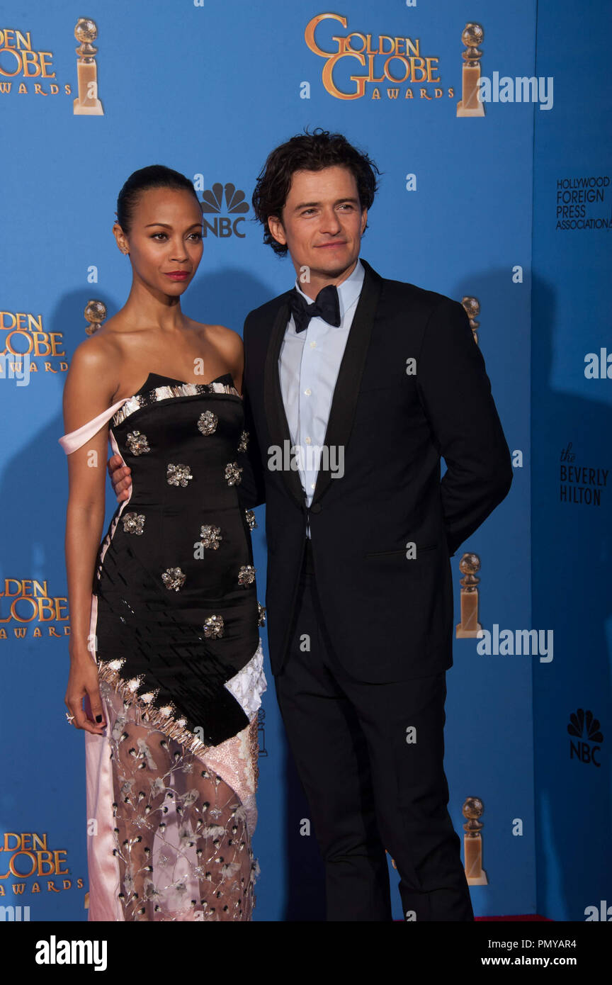 Zoe Saldana and Orlando Bloom at the 71st Annual Golden Globe Awards at the Beverly Hilton in Beverly Hills, CA on Sunday, January 12, 2014.  File Reference # 32222_397JRC  For Editorial Use Only -  All Rights Reserved Stock Photo