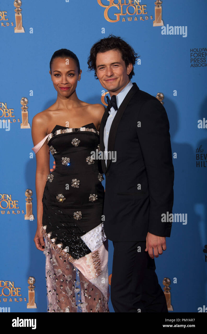 Zoe Saldana and Orlando Bloom at the 71st Annual Golden Globe Awards at the Beverly Hilton in Beverly Hills, CA on Sunday, January 12, 2014.  File Reference # 32222 400JRC  For Editorial Use Only -  All Rights Reserved Stock Photo
