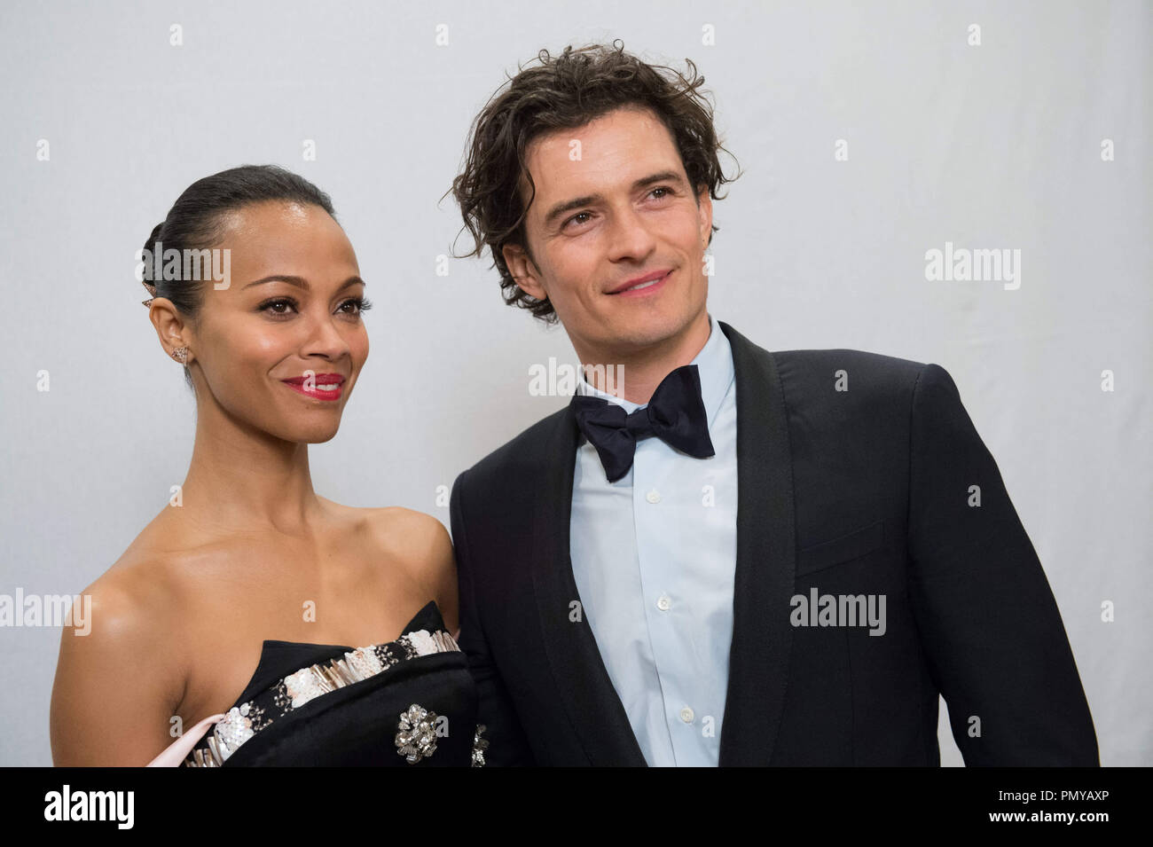 Zoe Saldana and Orlando Bloom at the 71st Annual Golden Globe Awards at the Beverly Hilton in Beverly Hills, CA on Sunday, January 12, 2014.  File Reference # 32222_472JRC  For Editorial Use Only -  All Rights Reserved Stock Photo