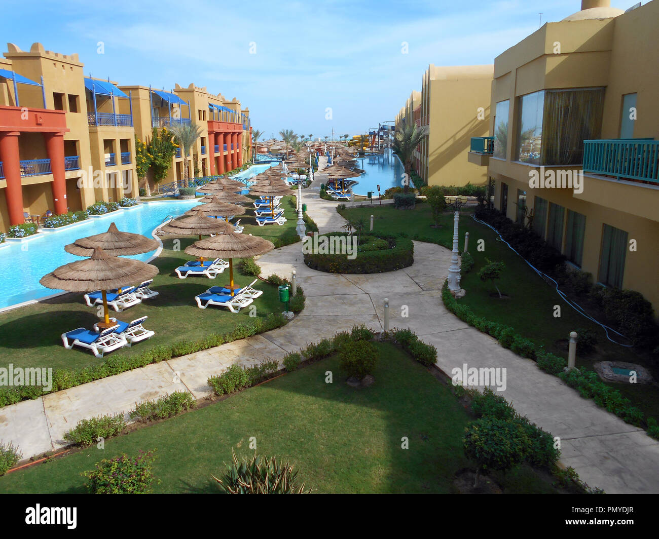 The low level apartments and swimming facilities at one of the many hotels at the Red Sea holiday of Hurghada in Egypt. Stock Photo