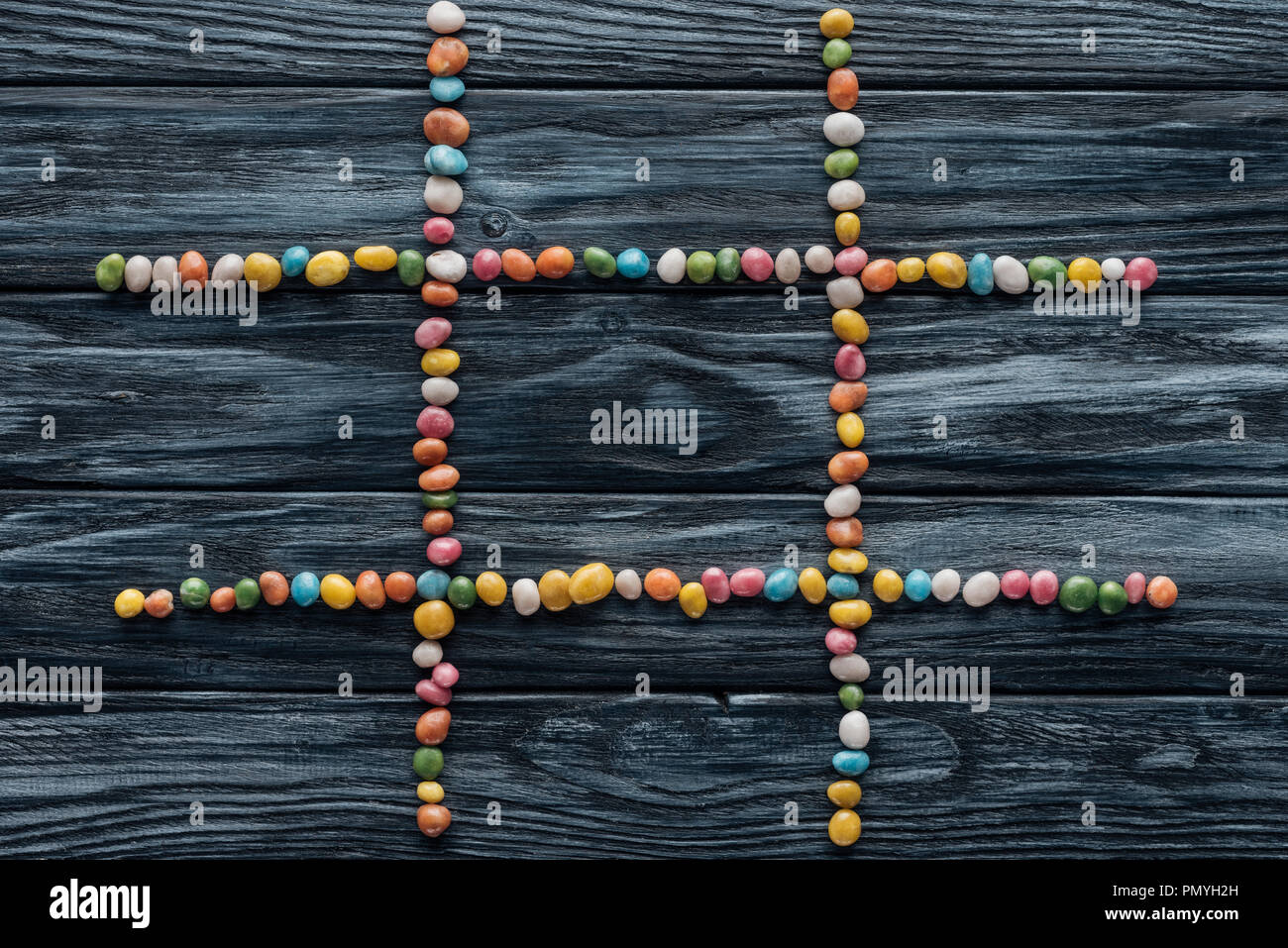 composition from colorful delicious candies on wooden table Stock Photo composition from colorful delicious candies on wooden table Stock Photo