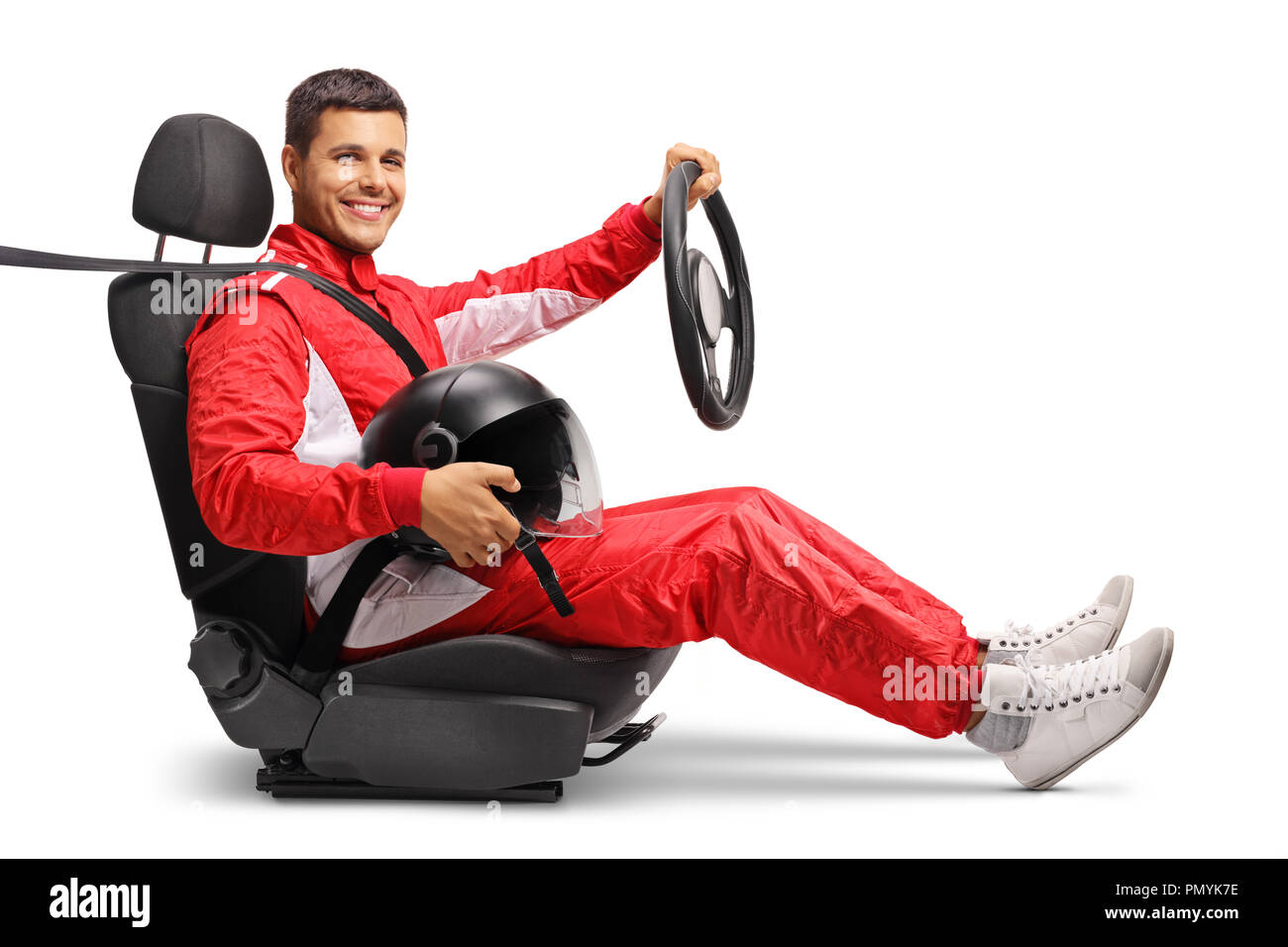 Racer in a car seat holding a wheel isolated on white background Stock Photo