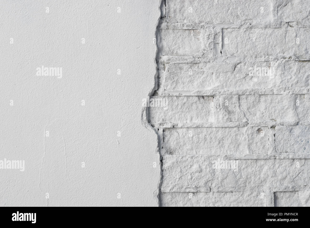 white brick wall plastered and painted background texture Stock Photo