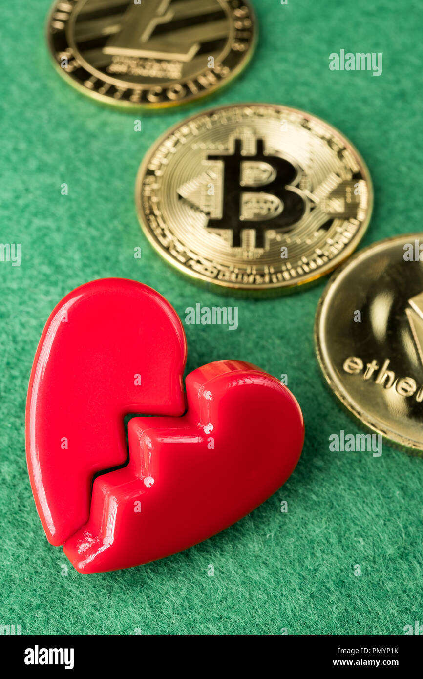 Gold physical Bitcoin, Litecoin and Ethereum coins with broken heart on  green background. Crypto currency market break or no love abstract concept  Stock Photo - Alamy