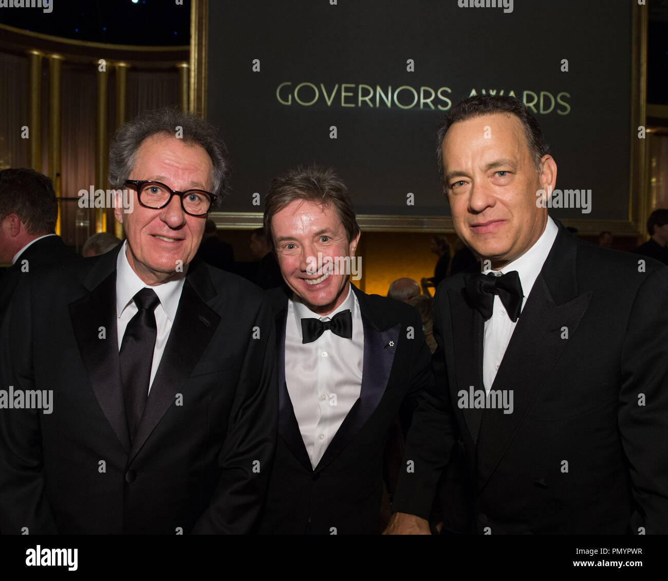 Actors Geoffrey Rush (left), Marin Short (center) and Tom Hanks attend the 2013 Governors Awards at The Ray Dolby Ballroom at Hollywood & Highland Center® in Hollywood, CA, on Saturday, November 16, 2013.  File Reference # 32184 017  For Editorial Use Only -  All Rights Reserved Stock Photo