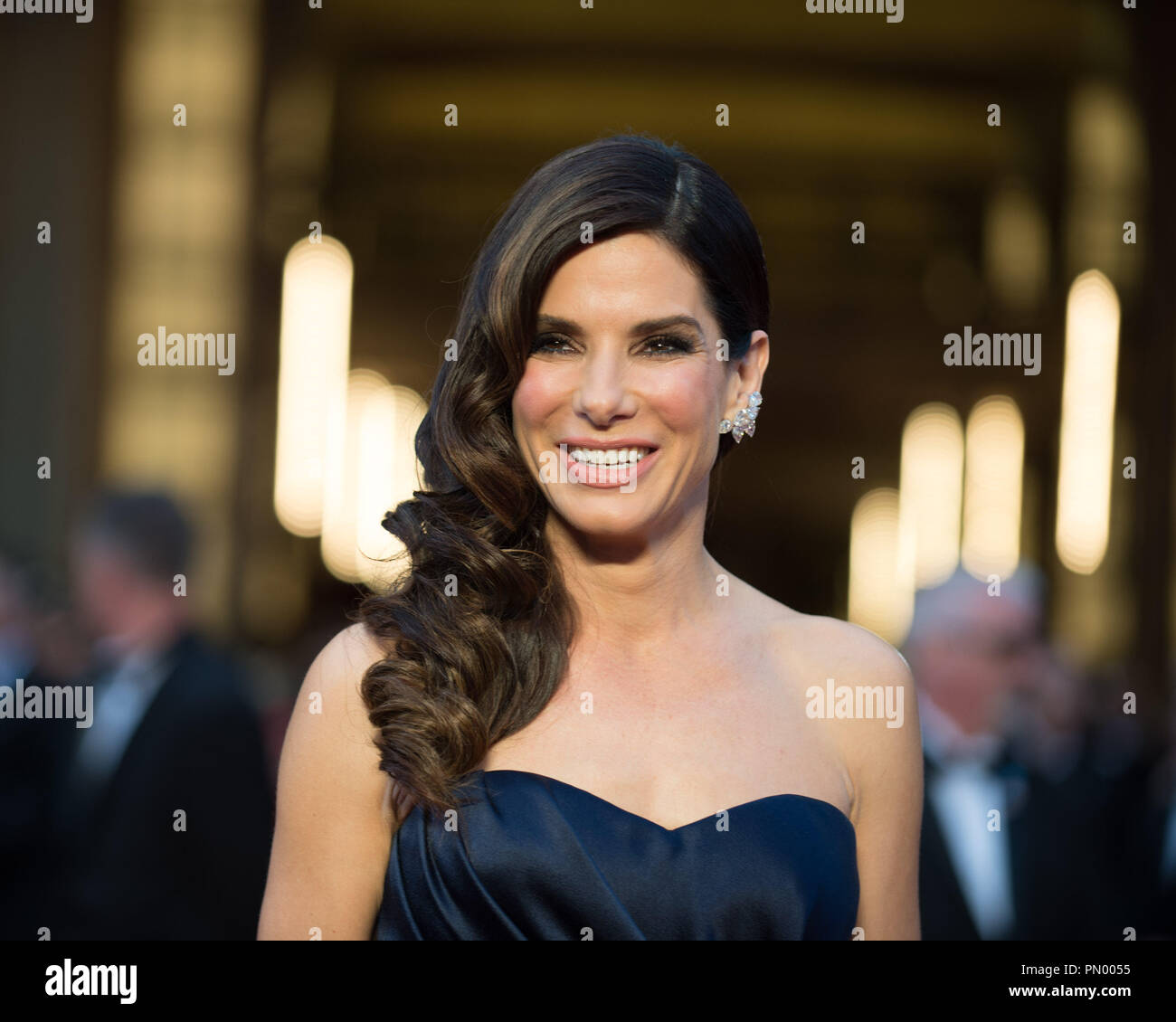https://c8.alamy.com/comp/PN0055/oscar-nominated-actress-sandra-bullock-arrives-for-the-live-abc-telecast-of-the-86th-oscars-at-the-dolby-theatre-on-march-2-2014-in-hollywood-ca-file-reference-32268-791-for-editorial-use-only-all-rights-reserved-PN0055.jpg
