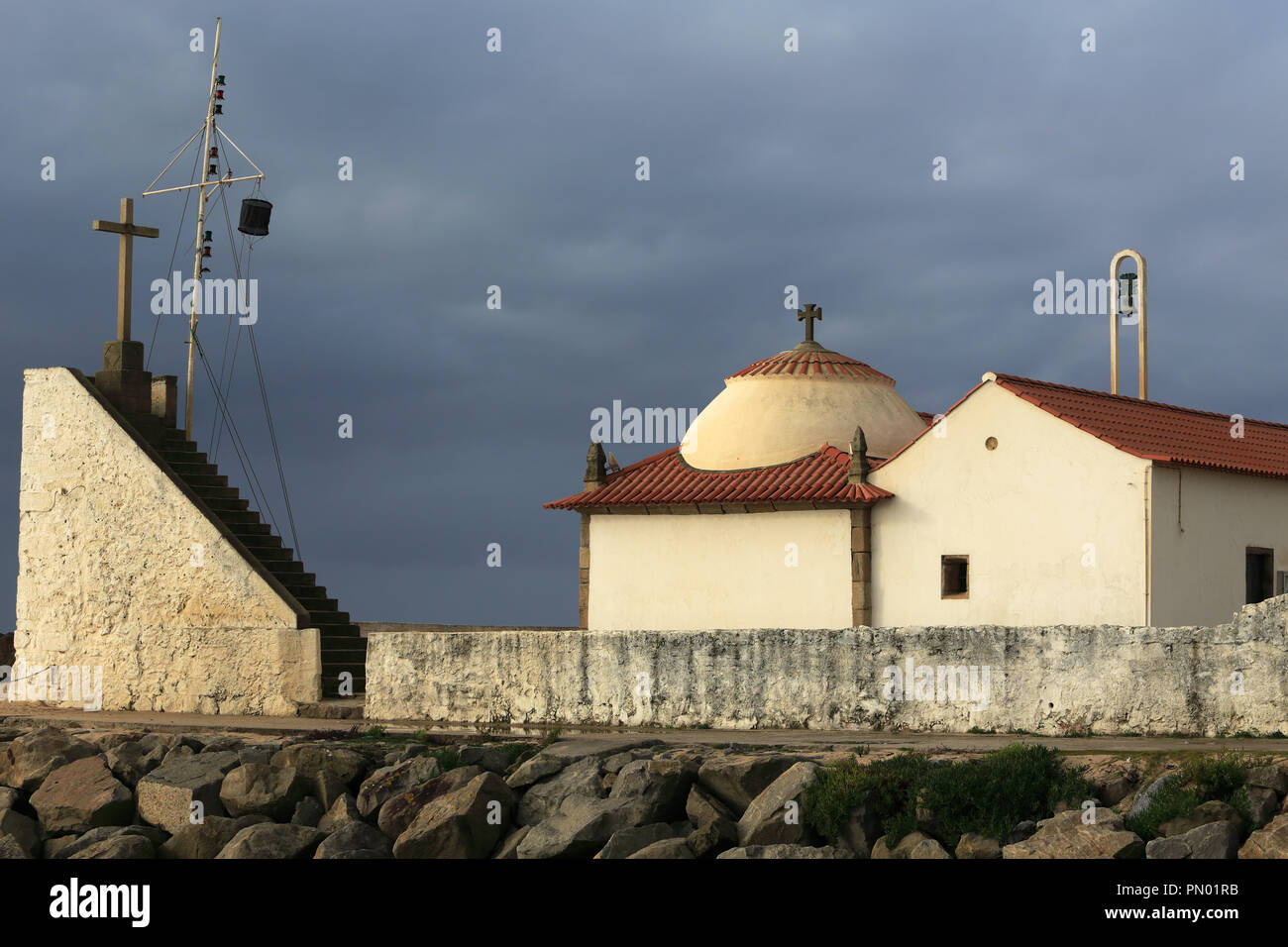 Humble chapel of Our Lady of Guia (Guidance) from the eleventh century near the sea, in Vila do Conde, Porto. It is a place of pilgrimage of portugues Stock Photo