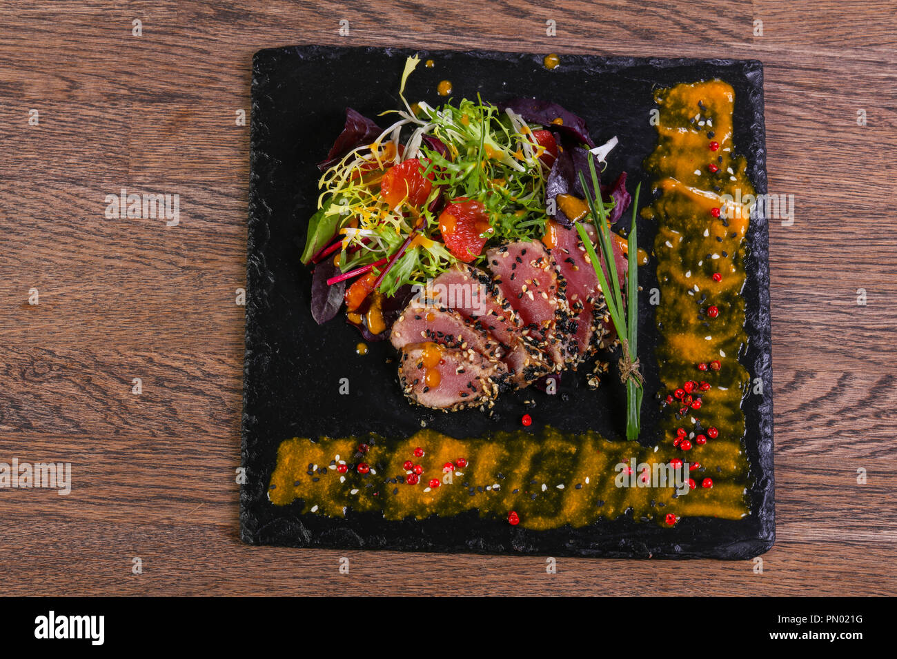 Tuna carpaccio with sauce and spices Stock Photo Alamy