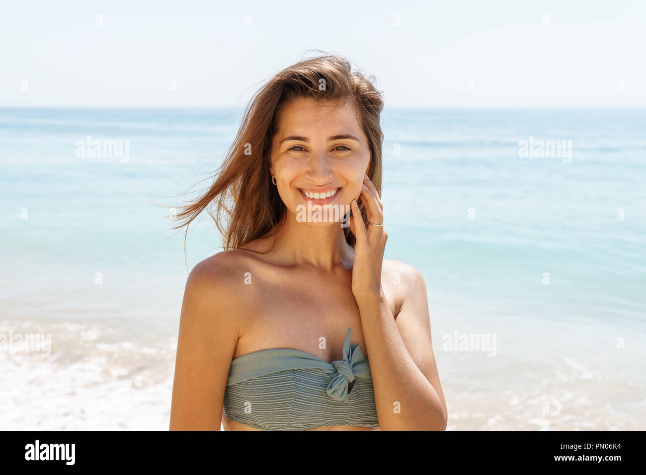 Beautiful Engaged Young Woman Portrait With Engagement Diamond Ring Feeling Happy On Beach Stock Photo