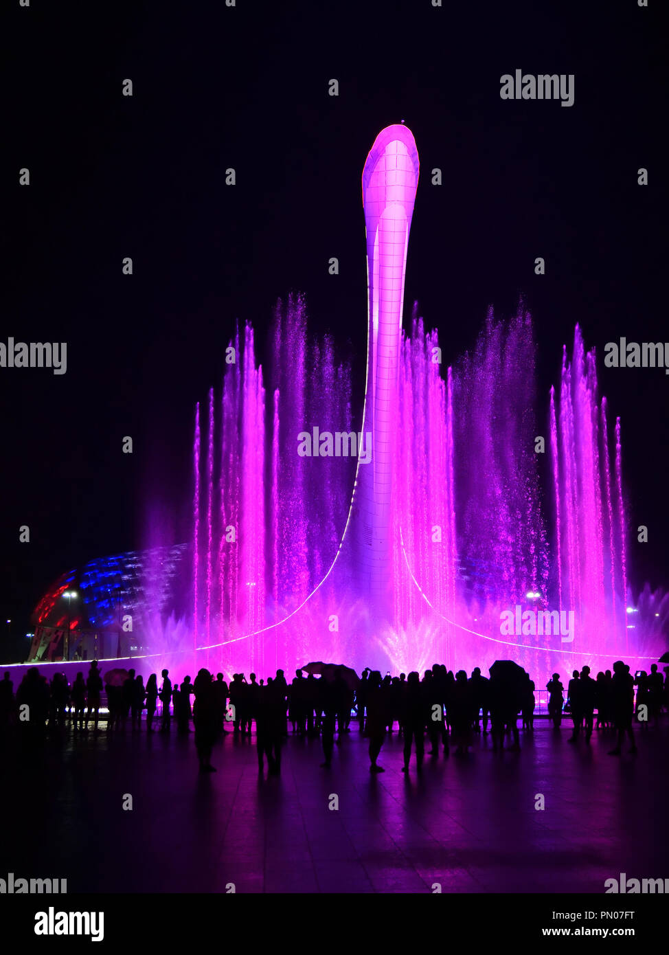 Sochi, Russia - May 29. 2018. Bowl of the Olympic flame Firebird and singing Fountain in the Olympic park in the evening. The main symbol of the Olymp Stock Photo