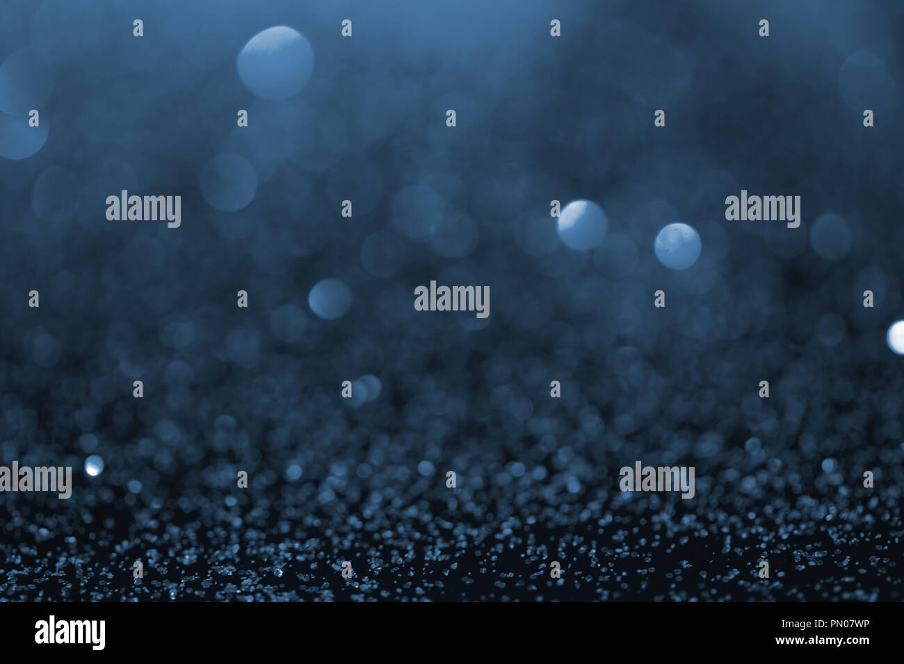 abstract blue glitter with bokeh on background Stock Photo - Alamy